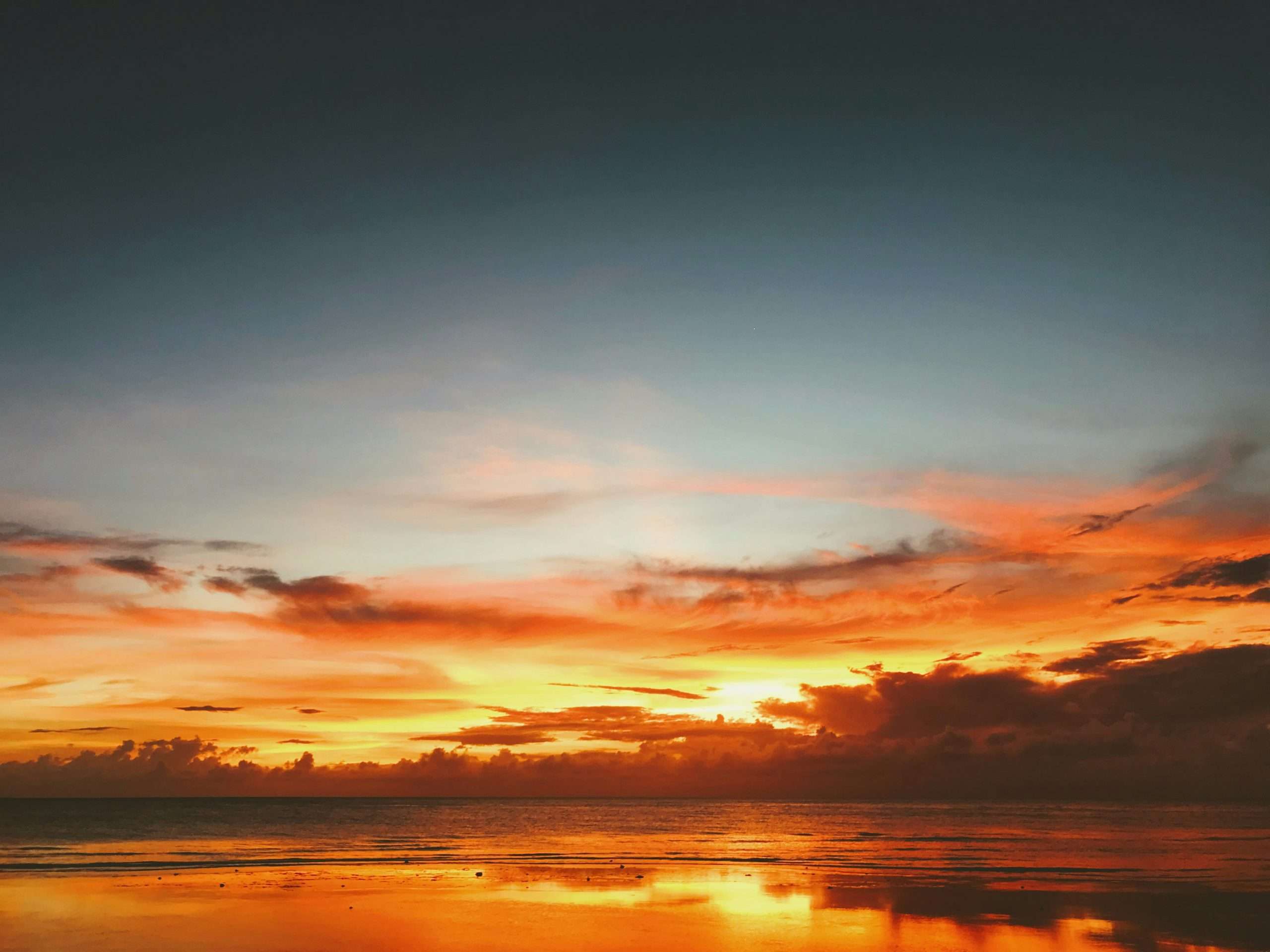 Bright yellow and red vibrant sunset over body of water | Photo by Aleksandar Popovski on Unsplash