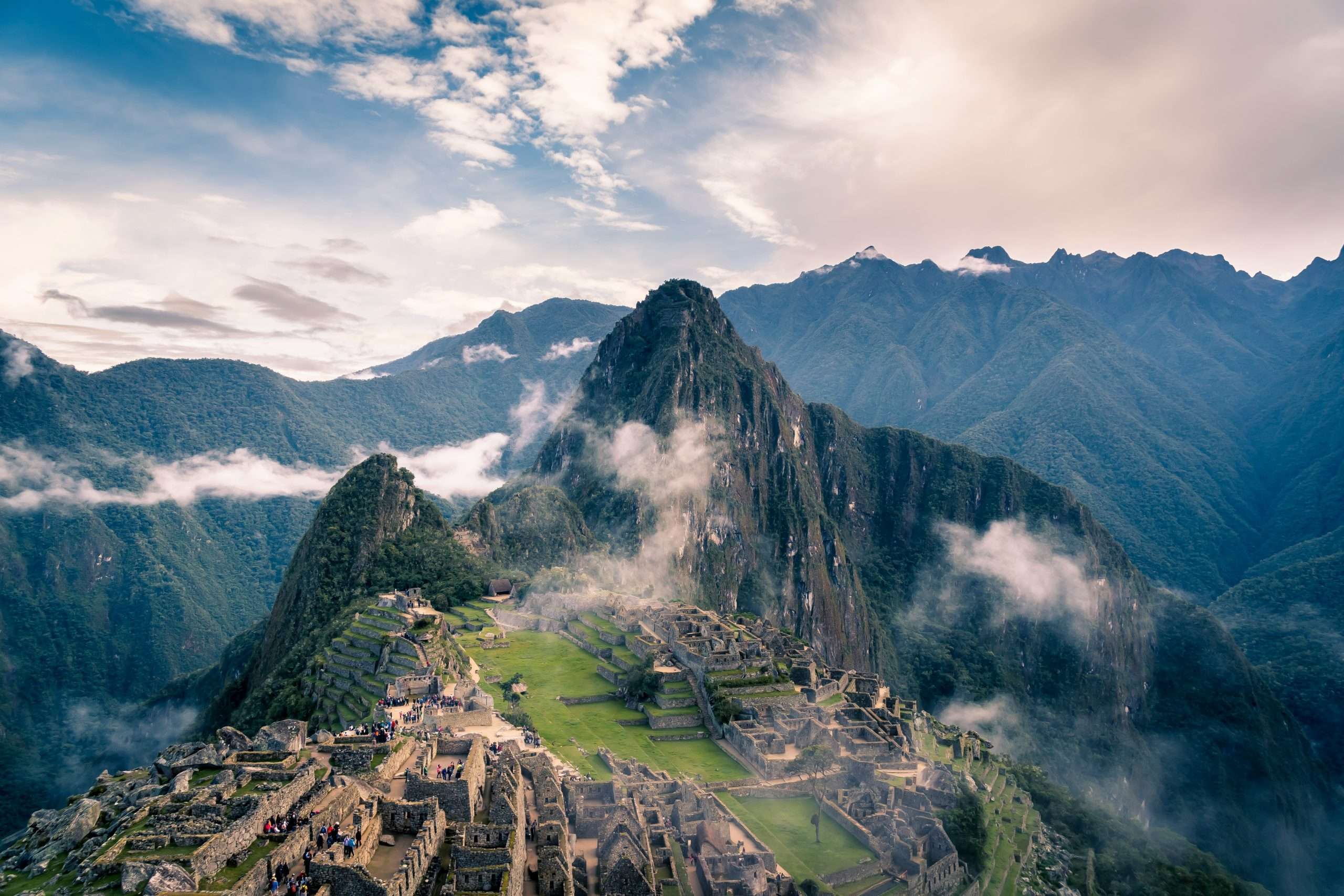 Aerial view of Machu Picchu ruins with low lying clouds | Photo by Willian Justen de Vasconcellos on Unsplash