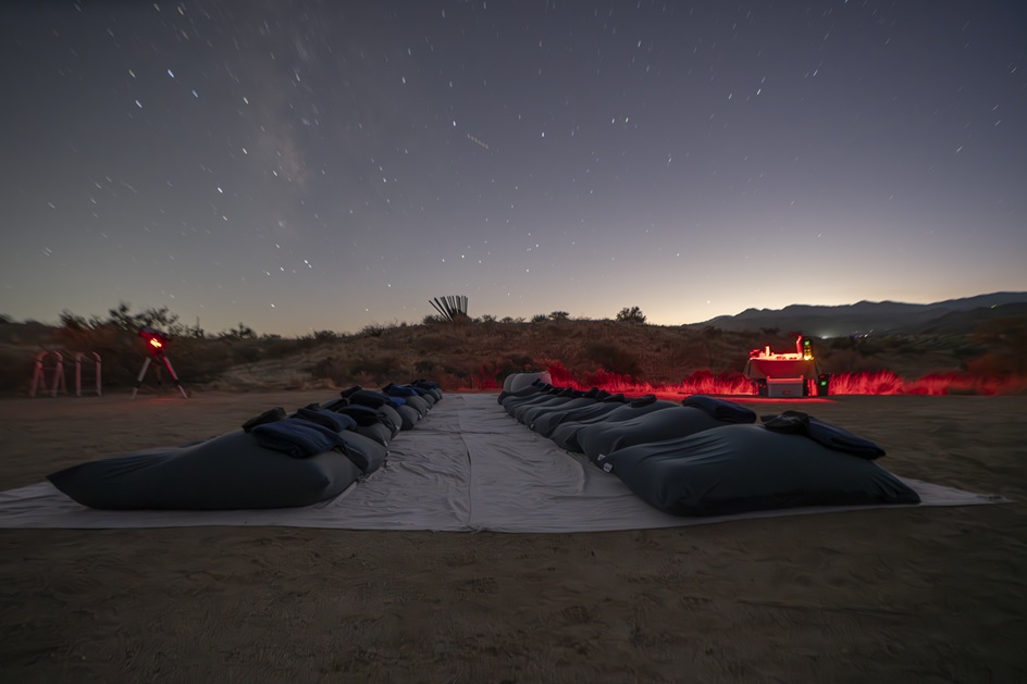 Cozy stargazing setup with reclining pads and blankets arranged under a starry sky during a Joshua Tree night sky tour.